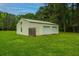 Detached garage with two garage doors and a side door at 225 Cantering Hills Ln, Summerville, SC 29483