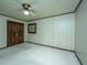 Spacious bedroom with wood double doors and wall paneling at 225 Cantering Hills Ln, Summerville, SC 29483
