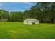 Large backyard with detached garage and expansive lawn at 225 Cantering Hills Ln, Summerville, SC 29483