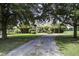 Brick house with landscaping and a long driveway at 120 Old Peafield Rd, Saint George, SC 29477