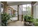 Relaxing screened porch with wooden deck and lush greenery at 120 Old Peafield Rd, Saint George, SC 29477