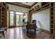 Spacious home office with built-in bookshelves and hardwood floors at 120 Old Peafield Rd, Saint George, SC 29477