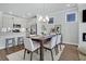 Elegant dining room adjacent to kitchen, featuring a farmhouse table at 127 O'Malley Dr, Summerville, SC 29483