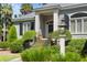 Gray house with black shutters, brick steps, and manicured landscaping at 2340 Marsh Hen Dr, Seabrook Island, SC 29455
