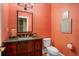 Small bathroom with coral walls and patterned tile at 2340 Marsh Hen Dr, Seabrook Island, SC 29455