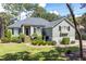 Single-story home with gray siding, black shutters, and a well-maintained lawn at 2340 Marsh Hen Dr, Seabrook Island, SC 29455