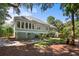Gray house exterior with mature landscaping and spacious deck at 2340 Marsh Hen Dr, Seabrook Island, SC 29455