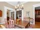 Bright dining room with hardwood floors, chandelier, and views to other rooms at 2340 Marsh Hen Dr, Seabrook Island, SC 29455