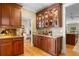 Butlers pantry features granite counters & wood cabinets at 2340 Marsh Hen Dr, Seabrook Island, SC 29455