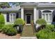 Gray house with black shutters, brick steps, and manicured landscaping at 2340 Marsh Hen Dr, Seabrook Island, SC 29455