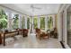 Sunroom with multiple windows, comfortable seating and a view of the backyard at 2340 Marsh Hen Dr, Seabrook Island, SC 29455