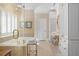 Elegant bathroom with a soaking tub, glass shower, and ample storage at 2340 Marsh Hen Dr, Seabrook Island, SC 29455
