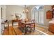 Elegant dining room with hardwood floors, chandelier, and large windows at 2340 Marsh Hen Dr, Seabrook Island, SC 29455