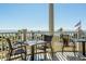 Oceanfront patio with tables and chairs offering scenic views at 2340 Marsh Hen Dr, Seabrook Island, SC 29455