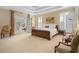 Spacious primary bedroom with a king-size bed and access to a private patio at 2340 Marsh Hen Dr, Seabrook Island, SC 29455