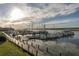 Calm waters reflect the sunset over a full marina at 2340 Marsh Hen Dr, Seabrook Island, SC 29455
