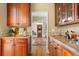 Butlers pantry with granite countertops and wood cabinets at 2340 Marsh Hen Dr, Seabrook Island, SC 29455