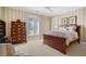 Well-lit bedroom with wood furniture and carpeting at 2340 Marsh Hen Dr, Seabrook Island, SC 29455