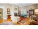 Spacious living room with hardwood floors, fireplace, and comfortable seating at 2340 Marsh Hen Dr, Seabrook Island, SC 29455