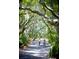 Three women bike riding under lush trees at 2340 Marsh Hen Dr, Seabrook Island, SC 29455