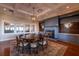 Round dining table with chairs, fireplace, and built-in shelving at 2340 Marsh Hen Dr, Seabrook Island, SC 29455