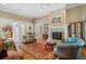 Spacious living room with hardwood floors, fireplace, and comfortable seating at 2340 Marsh Hen Dr, Seabrook Island, SC 29455
