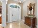 Bright entryway with tiled floor, white door, and ornate mirror at 2340 Marsh Hen Dr, Seabrook Island, SC 29455