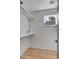 Functional linen closet with a window and light wood floors at 404 Sumter St, Charleston, SC 29403