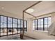 Main bedroom with ocean views, a four-poster bed, and access to a private deck at 3209 Marshall Blvd, Sullivans Island, SC 29482