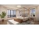 Bright bedroom with a canopy bed, ocean views, and hardwood floors at 3209 Marshall Blvd, Sullivans Island, SC 29482