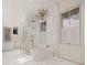 Spa-like bathroom featuring marble walls, a soaking tub, and a large shower at 3209 Marshall Blvd, Sullivans Island, SC 29482