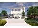 Two-car garage and landscaped grounds with a spacious driveway at 3209 Marshall Blvd, Sullivans Island, SC 29482