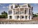 Luxury waterfront home with expansive balconies and pool at 3209 Marshall Blvd, Sullivans Island, SC 29482