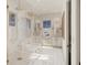 Elegant bathroom with marble finishes, a freestanding tub, and a walk-in shower at 3209 Marshall Blvd, Sullivans Island, SC 29482