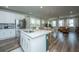 Open concept kitchen with white cabinets, island, and stainless steel appliances at 210 Winding River Dr, Johns Island, SC 29455