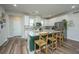 Modern kitchen with white cabinets, stainless steel appliances and a green island at 210 Winding River Dr, Johns Island, SC 29455