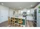 Modern kitchen with white cabinets, stainless steel appliances, and a large island at 210 Winding River Dr, Johns Island, SC 29455