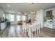 Dining area with white table and chairs, and view into the living room at 210 Winding River Dr, Johns Island, SC 29455