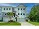 Two-story townhome with attached garage and front yard at 210 Winding River Dr, Johns Island, SC 29455
