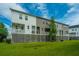 Townhomes with a shared grassy backyard and raised foundation at 210 Winding River Dr, Johns Island, SC 29455
