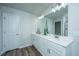 Double vanity bathroom with a white quartz countertop and modern light fixtures at 210 Winding River Dr, Johns Island, SC 29455