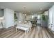 Open concept kitchen with white cabinets, stainless steel appliances, and a large island at 210 Winding River Dr, Johns Island, SC 29455
