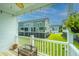 Relaxing back porch with ceiling fan, string lights, and view of community at 210 Winding River Dr, Johns Island, SC 29455