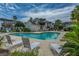 Community pool with surrounding lounge chairs and landscaping at 210 Winding River Dr, Johns Island, SC 29455