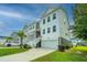 Two-story townhome with attached garage and front yard at 210 Winding River Dr, Johns Island, SC 29455