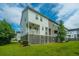 Two-story townhome with a backyard, raised foundation, and a private deck at 210 Winding River Dr, Johns Island, SC 29455