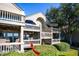Ground level patio with stairs leading to the second floor at 1351 Pelican Watch Villas, Seabrook Island, SC 29455