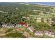 Aerial view of coastal community, showing property location among other homes and golf course at 1351 Pelican Watch Villas, Seabrook Island, SC 29455