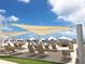 Beachfront lounge chairs and shade structures at 1351 Pelican Watch Villas, Seabrook Island, SC 29455