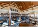 Clubhouse dining area with blue banquettes and wooden tables at 1351 Pelican Watch Villas, Seabrook Island, SC 29455
